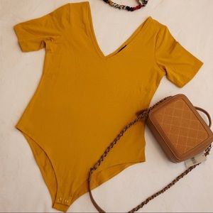 Mustard F21 V Neck Bodysuit L